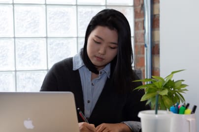 A woman working alone at her desk